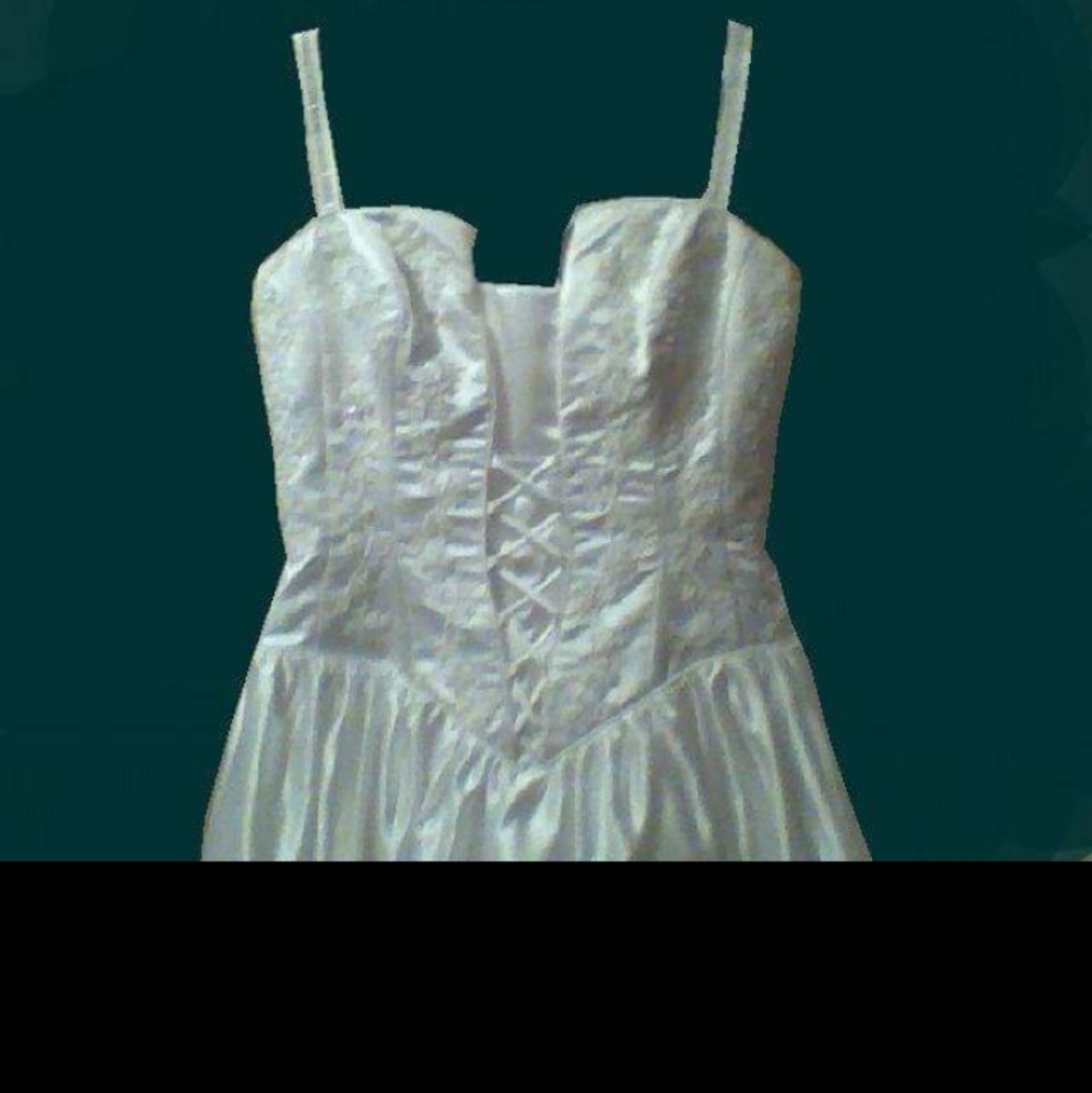 White wedding dress with bead accents and long train. Size 10